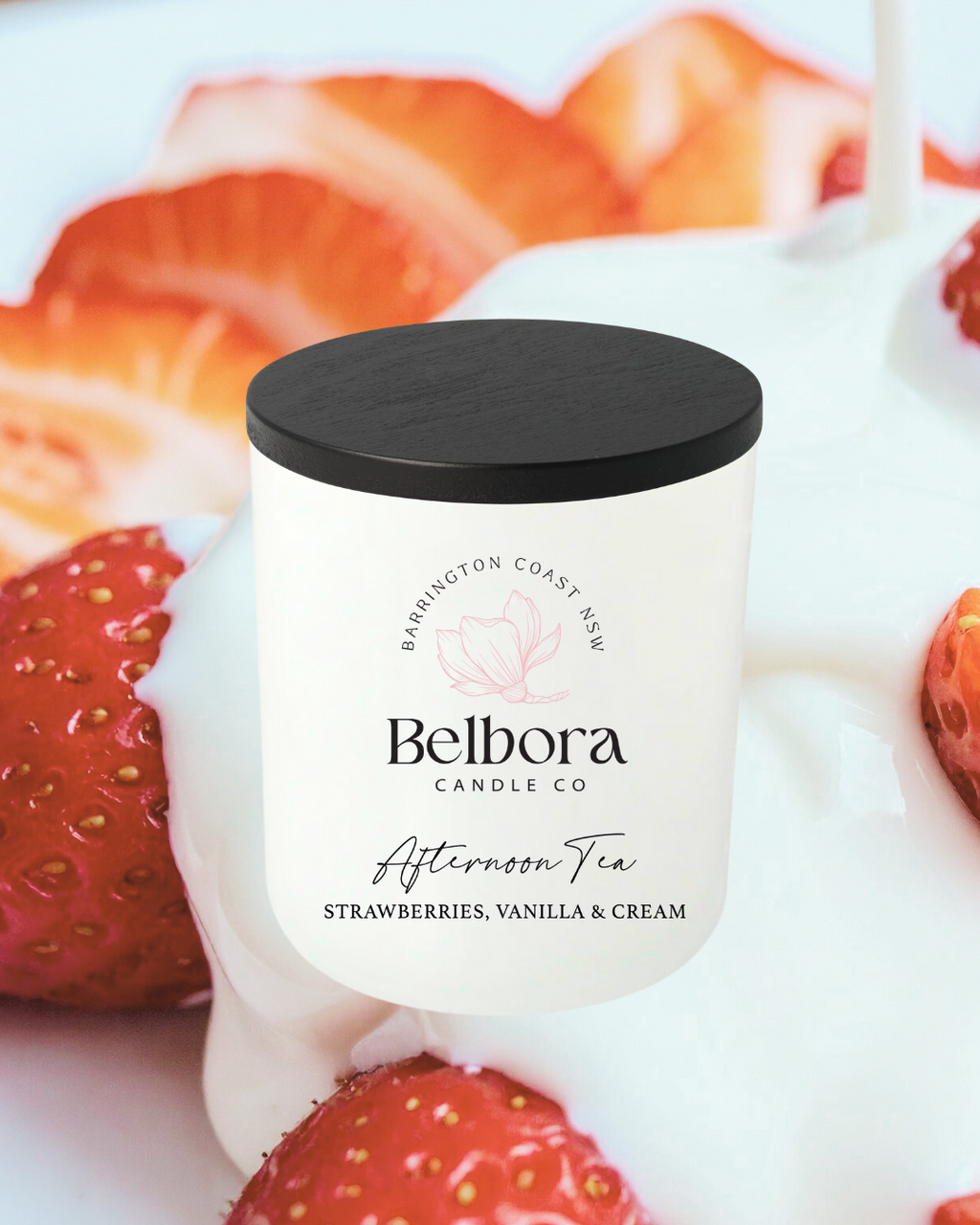 Belbora Candle Co Afternoon Tea candle with strawberries and cream in the background