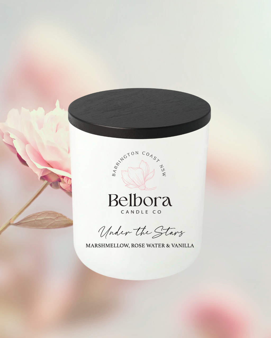Belbora Candle Co under the stars candle with a black lid on a blurred floral background