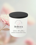 Belbora Candle Co under the stars candle with a black lid on a blurred floral background