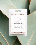 Belbora Candle Co. Bush Walks wax melt packaging on green eucalyptus leaves