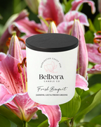 Belhora Candle Co Fresh Bouquet  candle with pink lilies in the background