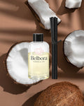 Belbora candle co Heading to the coast reed diffuser refill with coconut halves on a brown background