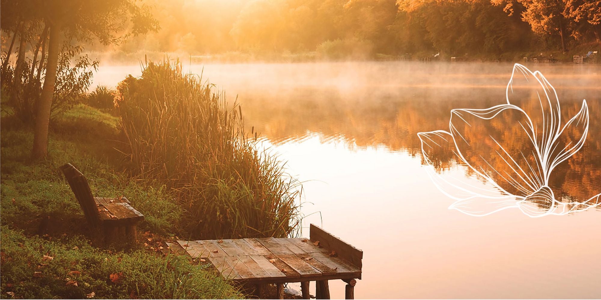 Peaceful lakeside scene with a wooden bench and misty water at sunrise with the Belbora Candle Co Magnolia Logo overlay