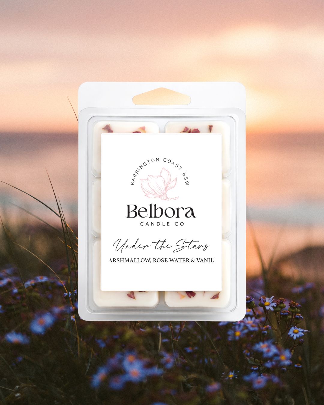 Belbora Candle Co Under the Stars Wax Melts wax melt package with a sunset and flowers in the background
